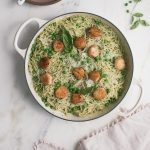 Overhead image of seafood pasta in a dutch oven.