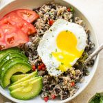 Gallo Pinto with eggs, tomato and avocado.