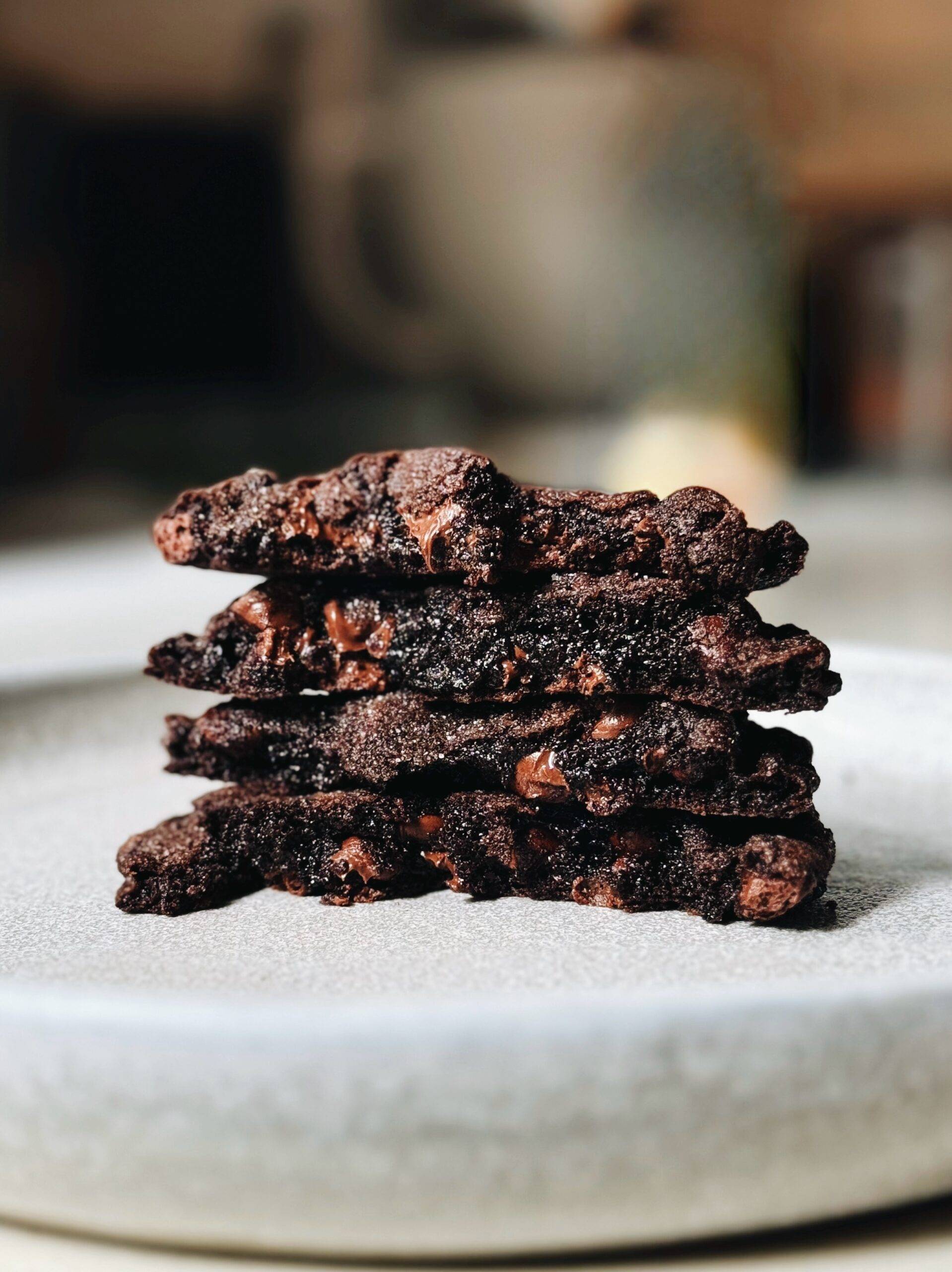 Gooey chocolate cookies stacked together.