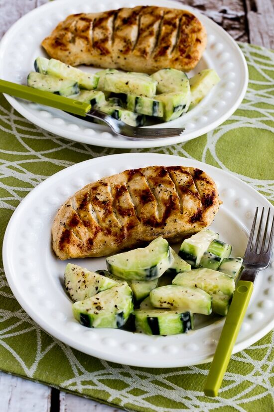 close-up shot of Completely Foolproof 100% Delicious Grilled Chicken finished chicken on plate with Cucumbers Caesar