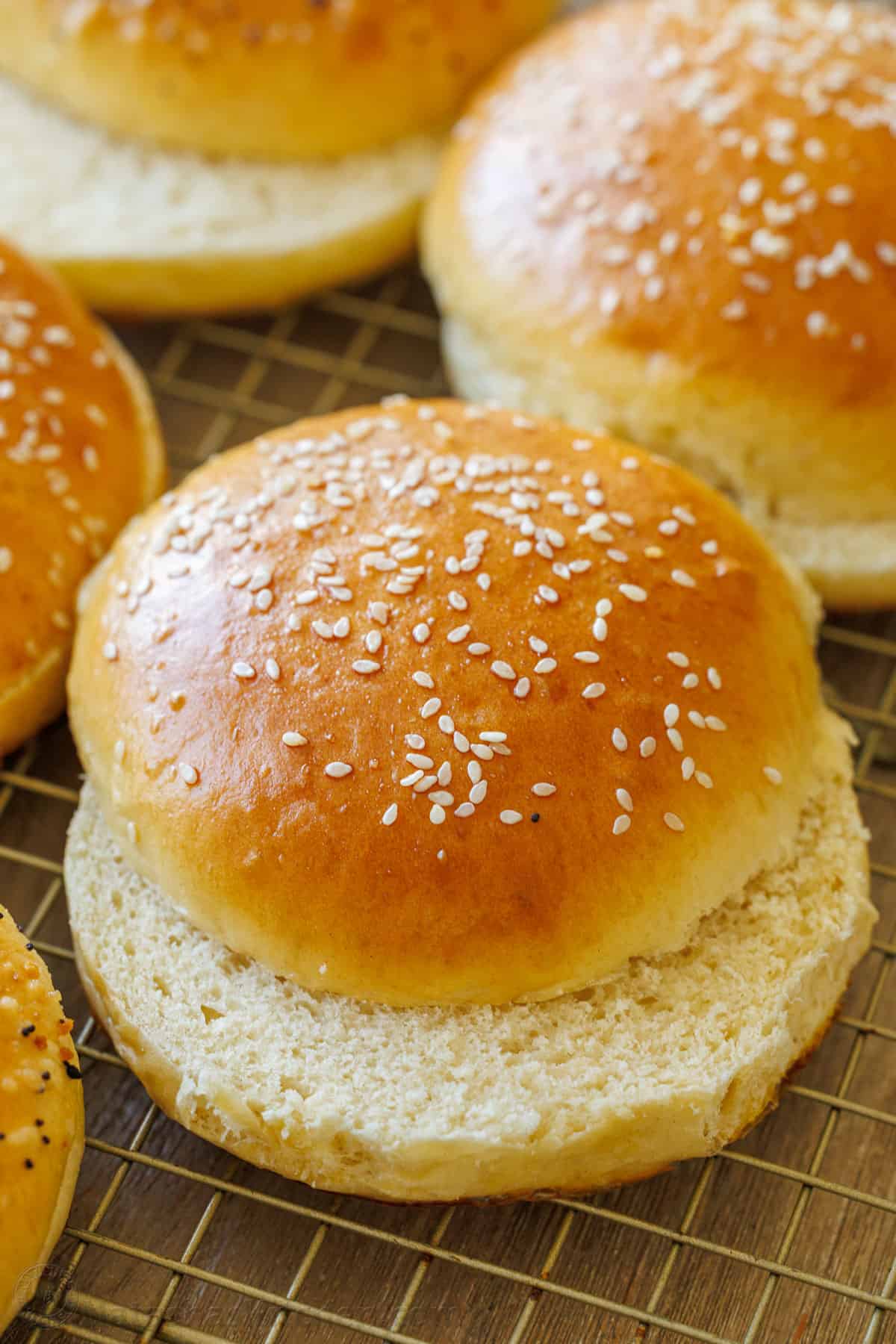 Cut homemade hamburger buns with sesame seeds