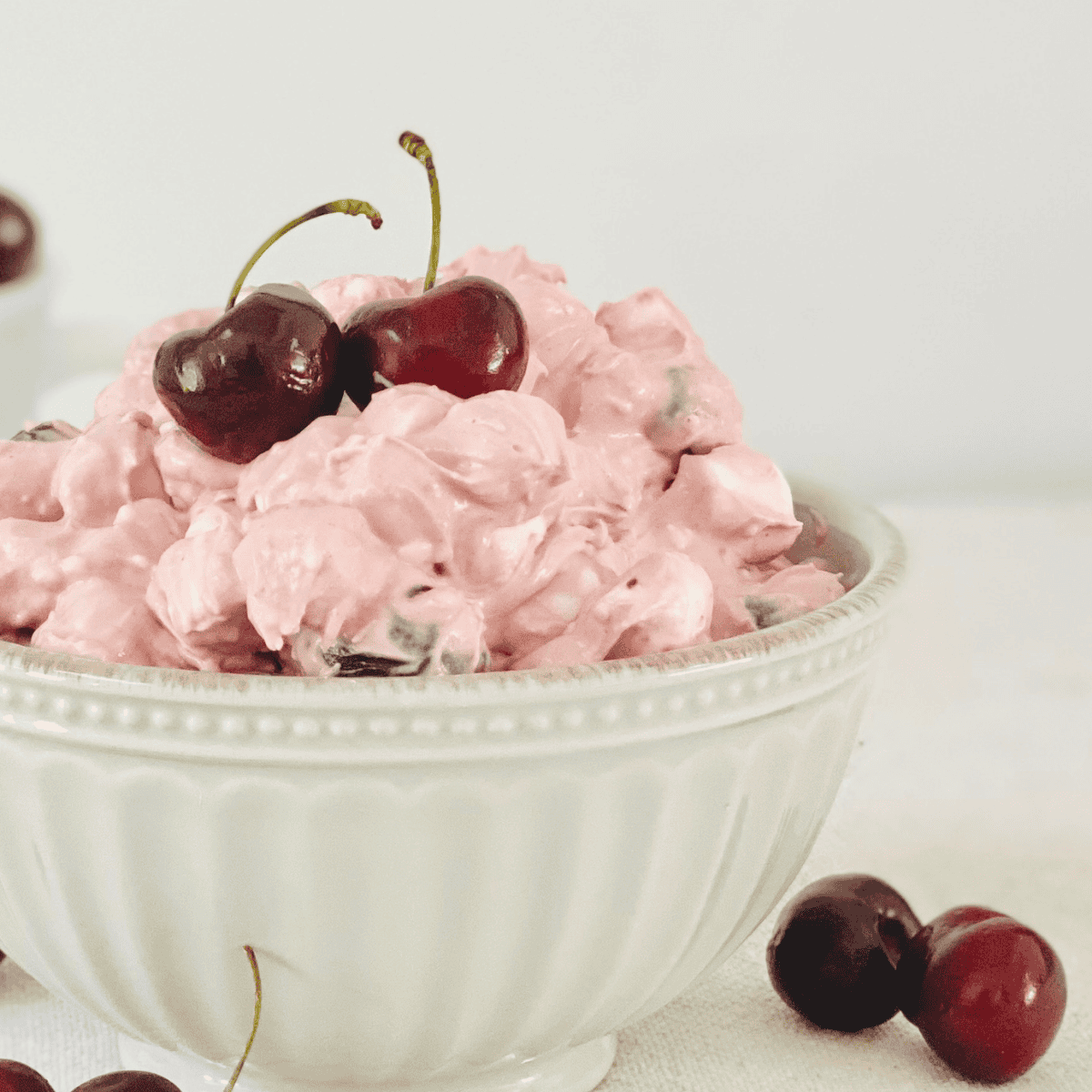 Close up image of cherry fluff in a white bowl