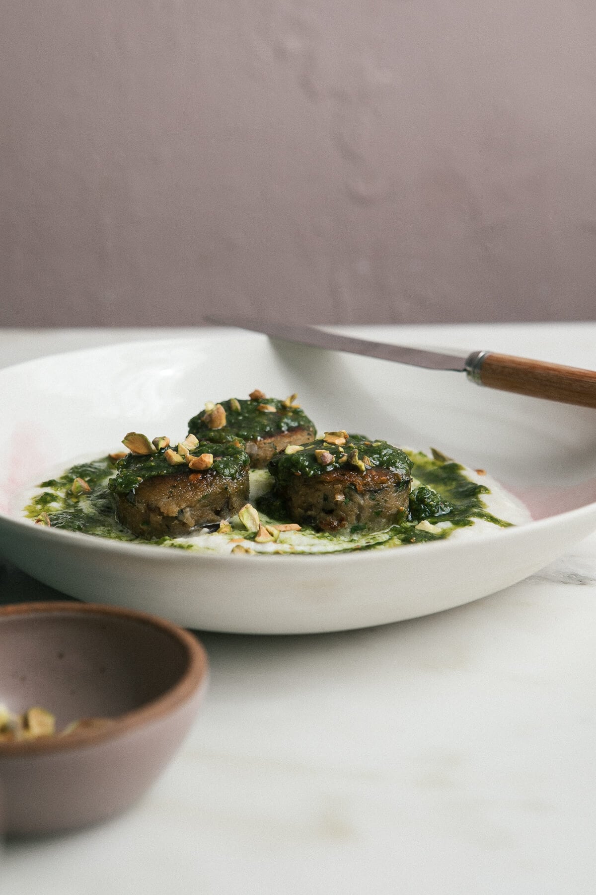 Eggplant Meatballs over Cauliflower Puree and Pesto