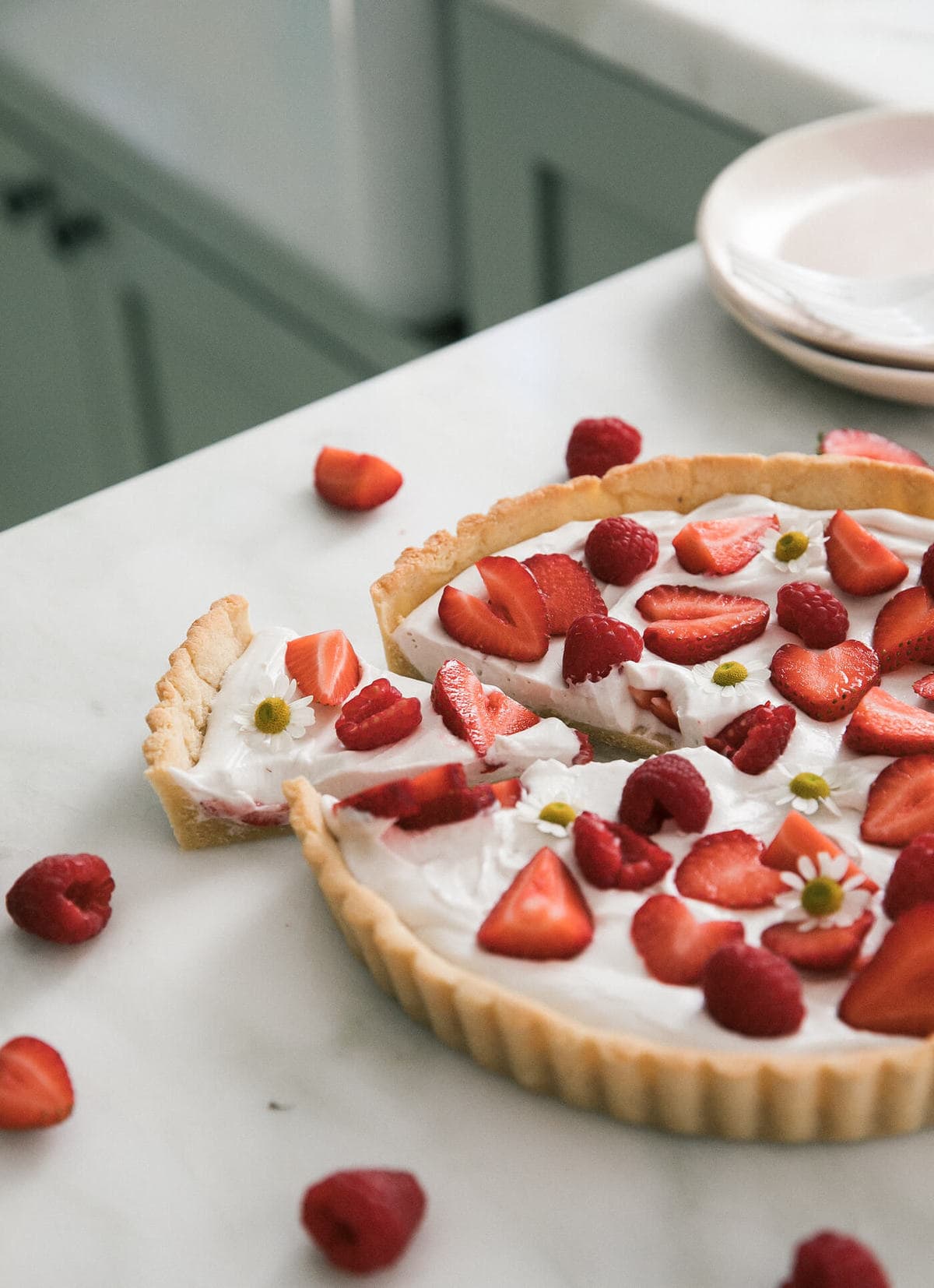 A sliced Gluten-Free Strawberry Tart on a counter.