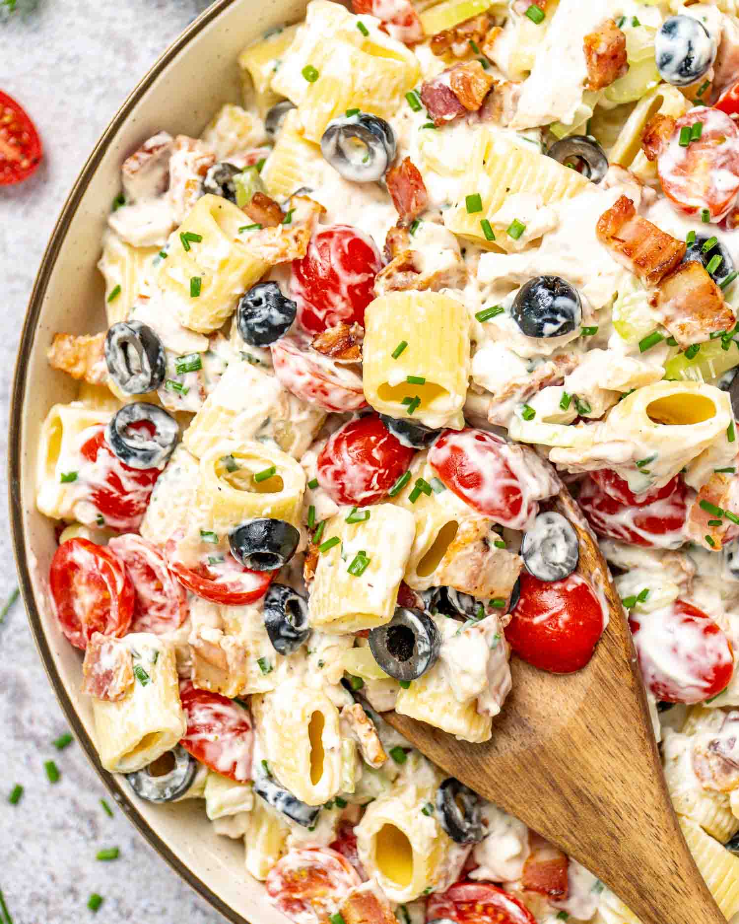 chicken ranch pasta salad in a beige bowl.