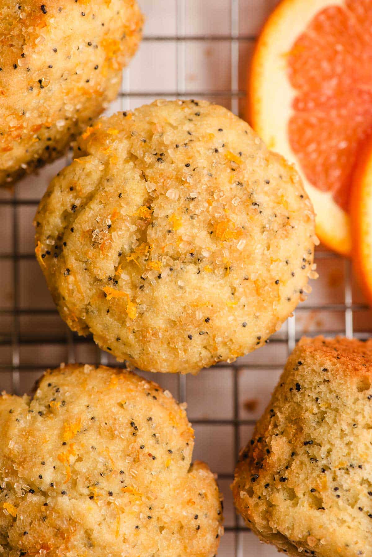 Orange muffins sprinkled with coarse sugar and orange zest.