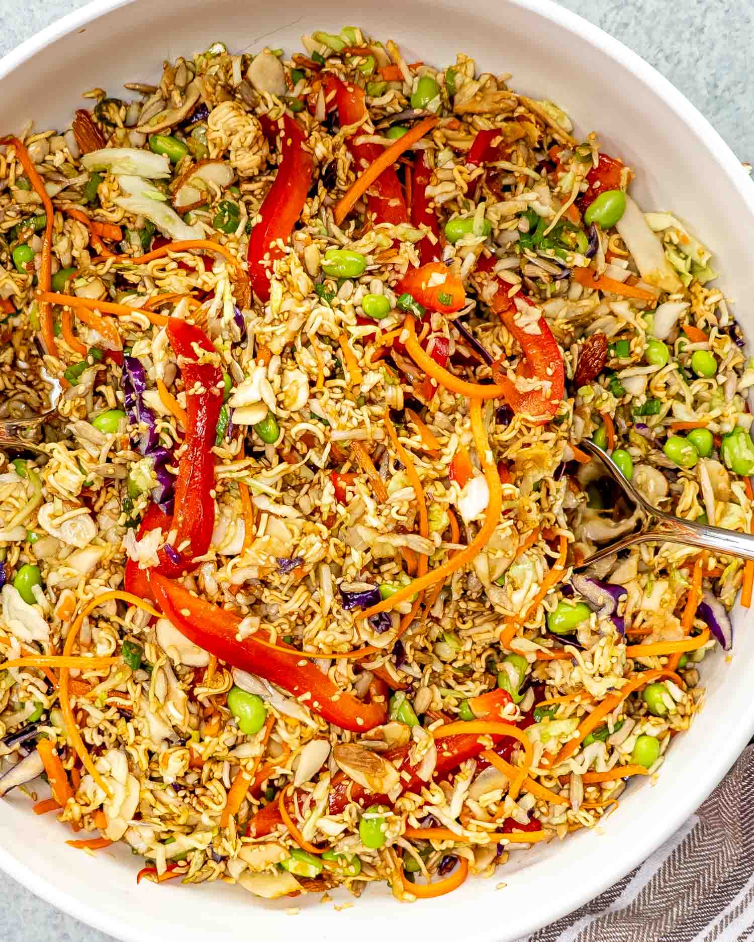 fresh ramen noodle salad in a big white bowl.